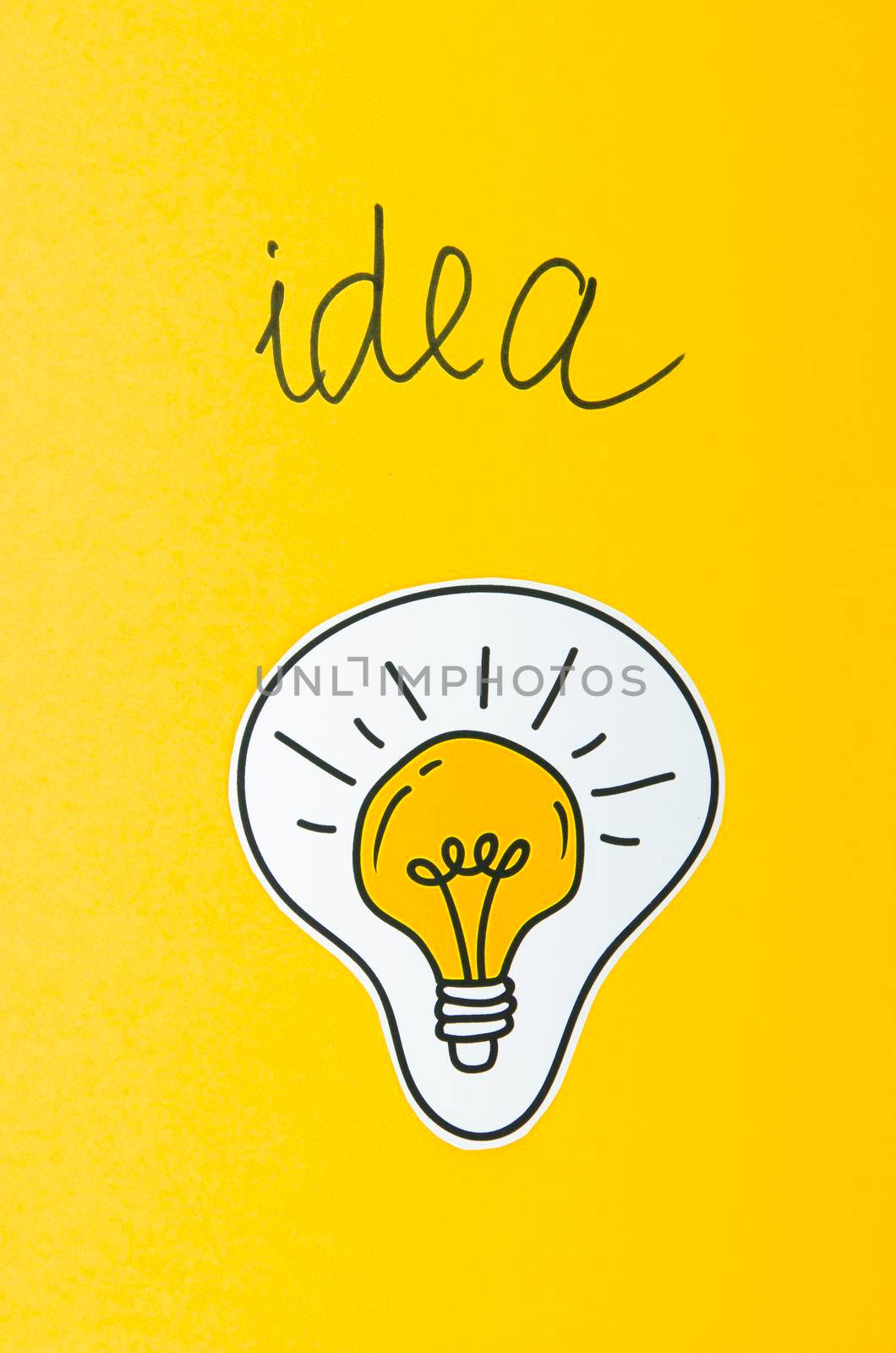 light bulb idea concept yellow background. High resolution photo