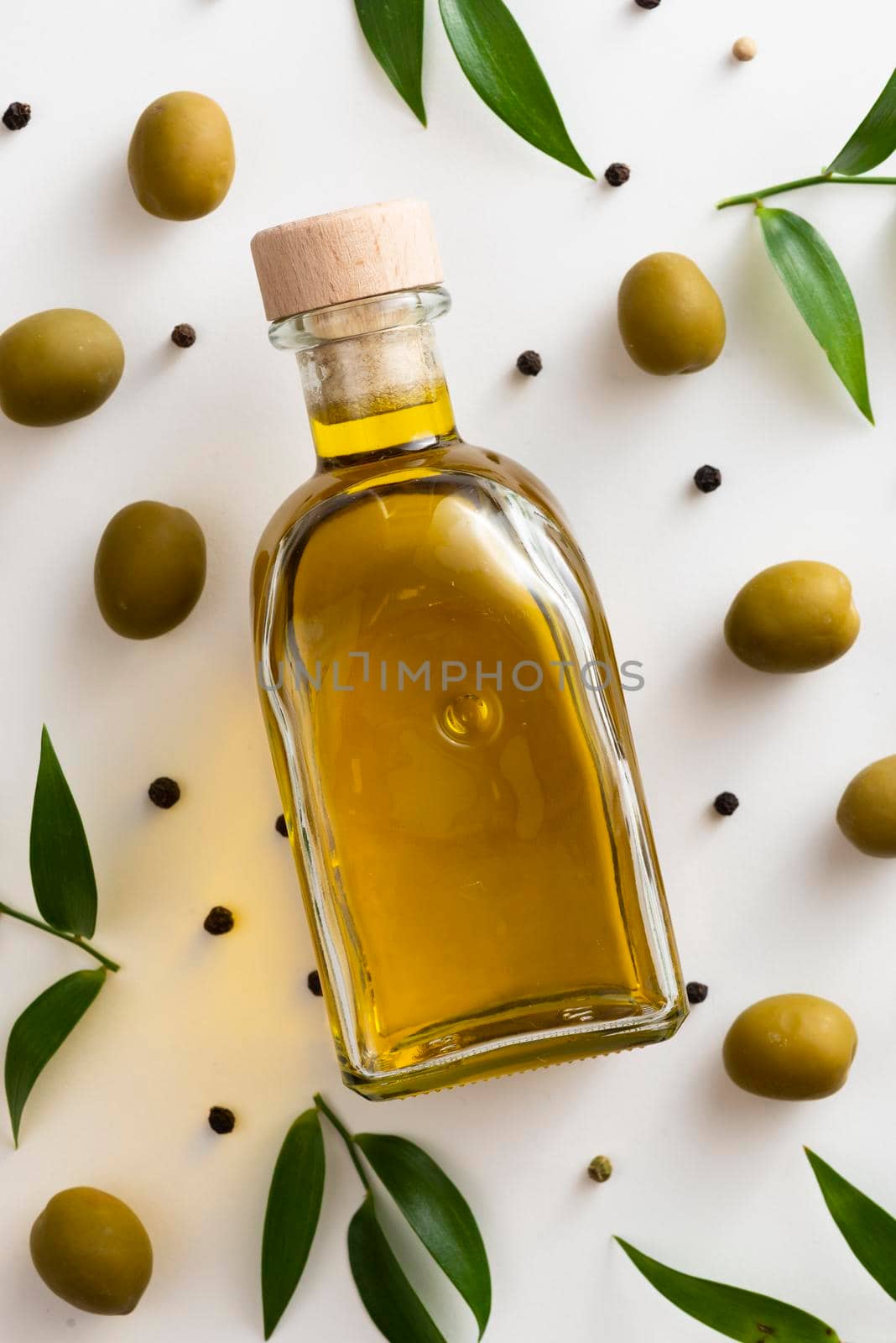 olives oil bottle table. High resolution photo