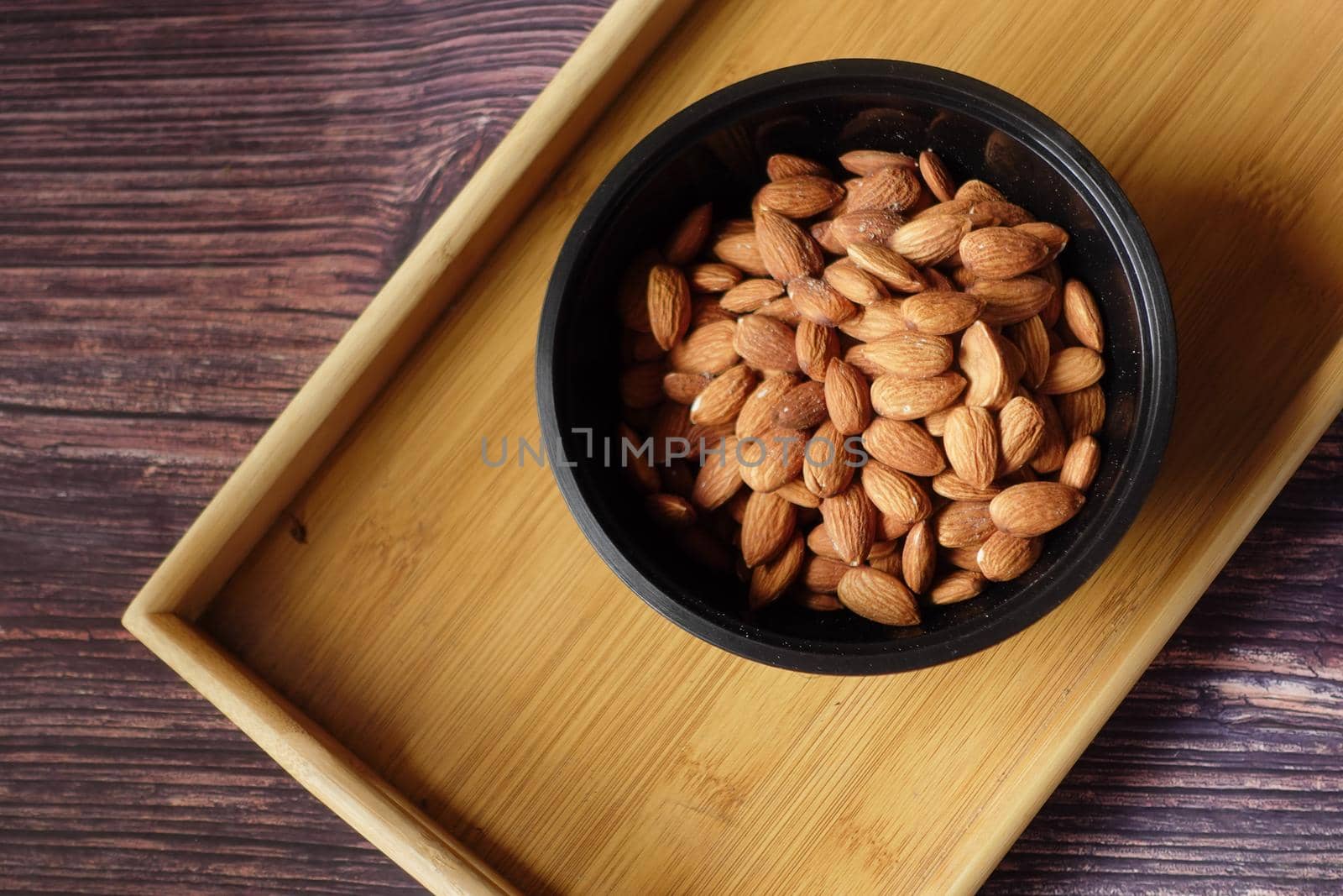 top view of almond nut in a bowl on table .