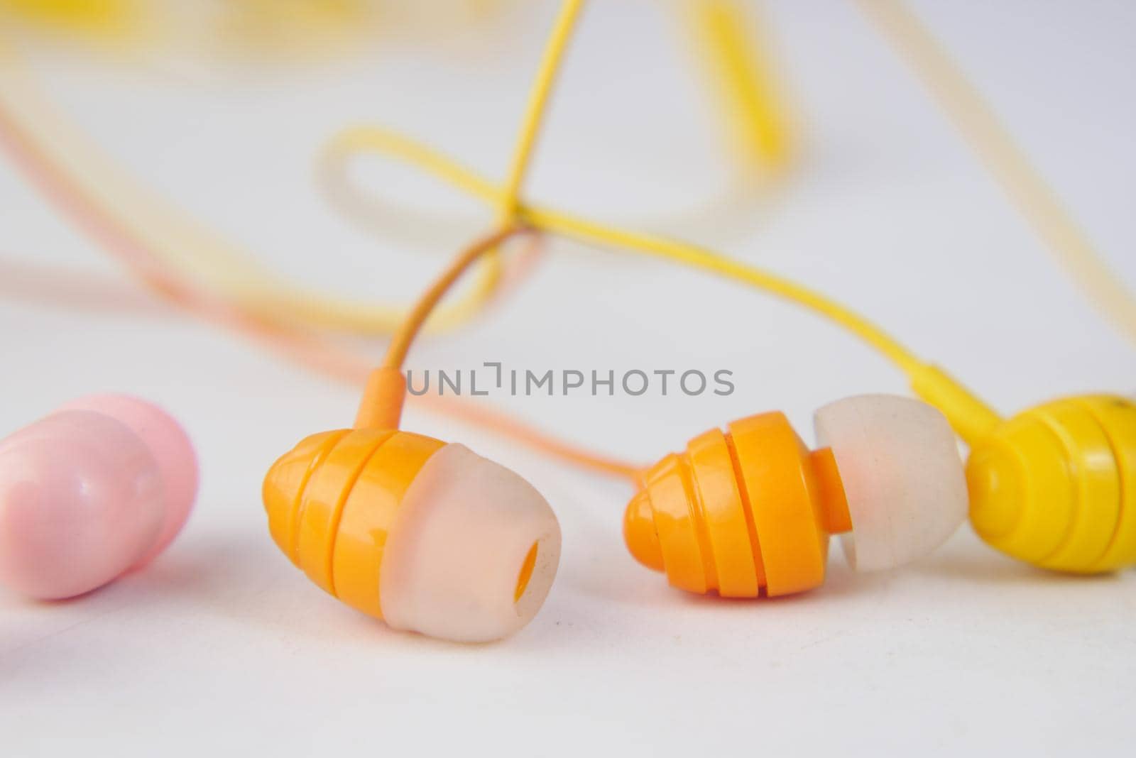 close up of colorful earphone on white background ,