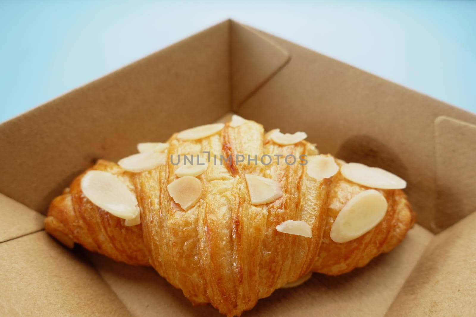 fresh baked croissant in a bow on table .