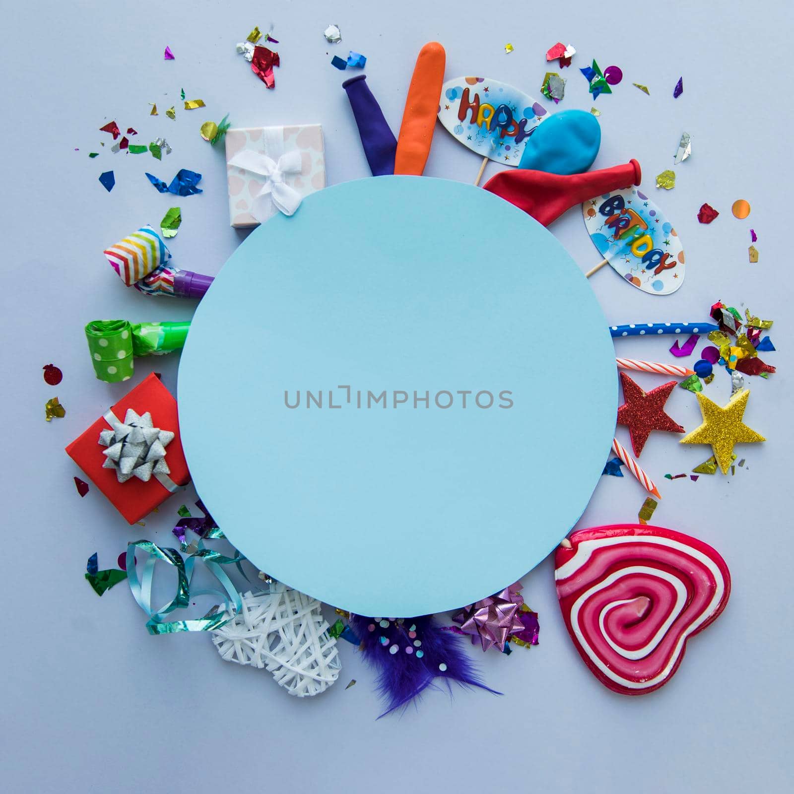 blank blue circular frame birthday party items background. High quality photo by Zahard