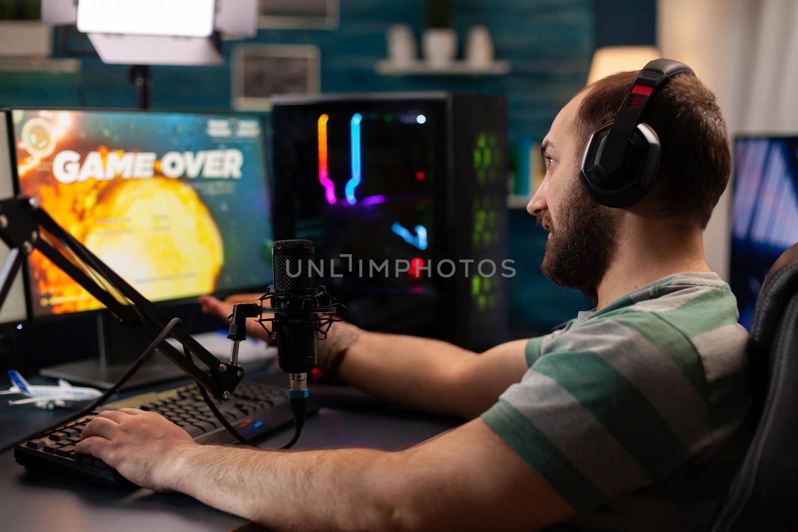 Streamer losing virtual videogames competition use professional setup with streaming chat open. Online cyber performing during gaming tournament using technology network wireless