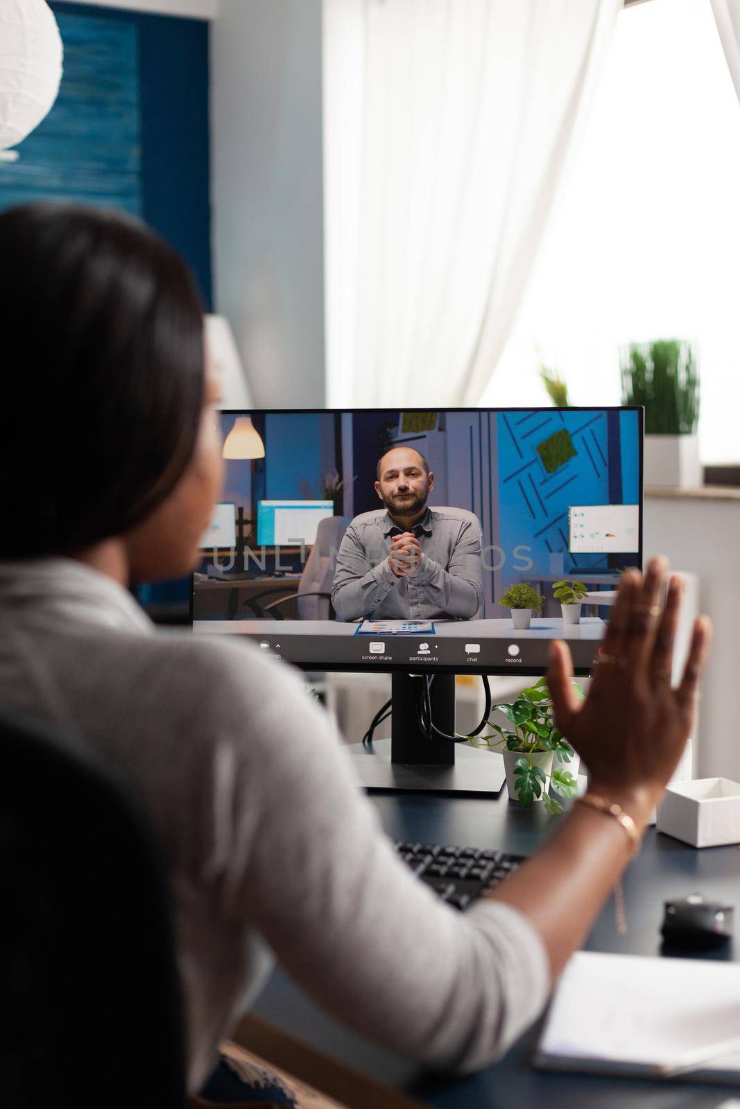 African american woman greeting remote entrepreneur using laptop computer webcam during online videocall meeting teleconference. Overworked black student discussing academic course ideas