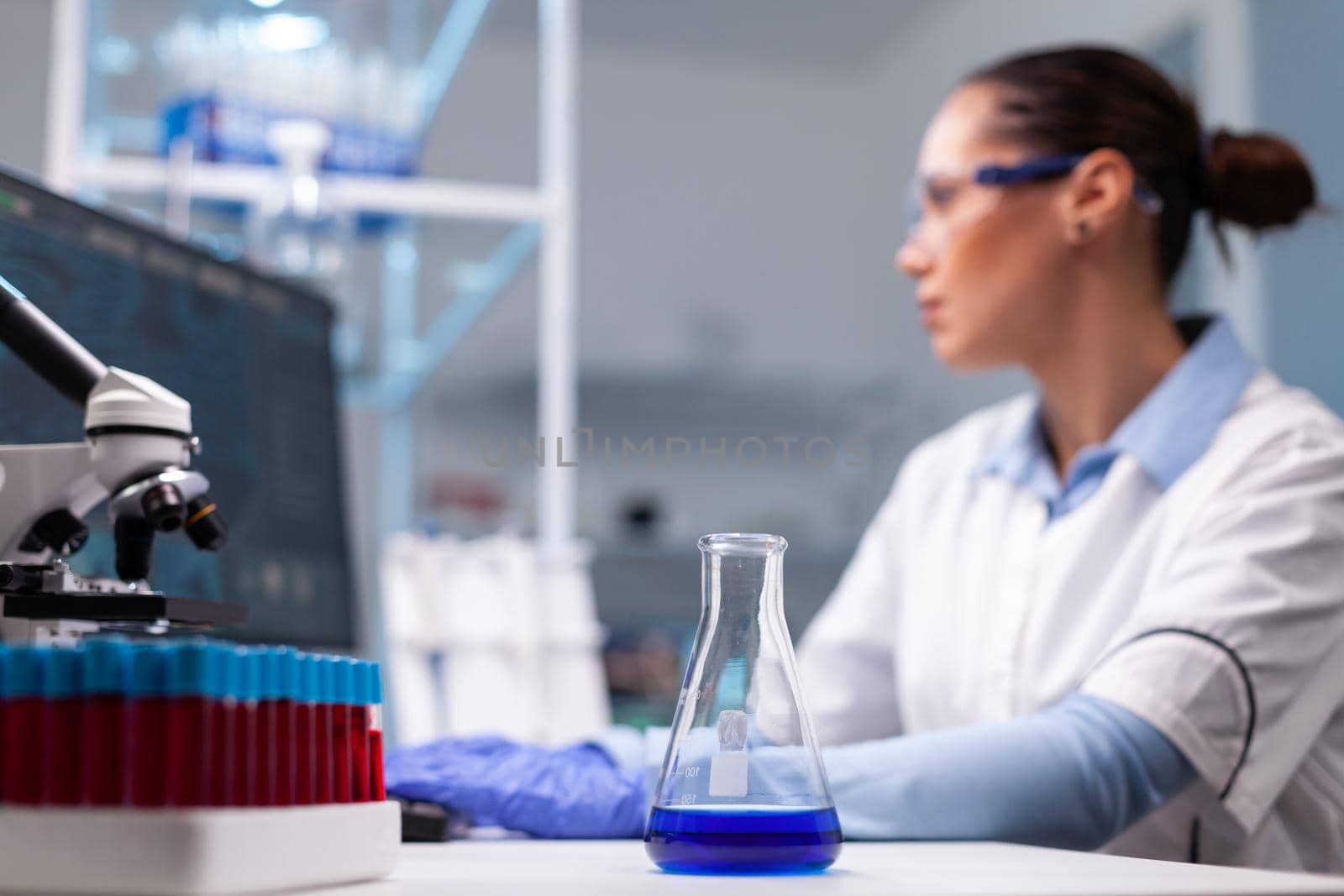 Scientist researcher woman typing pharmaceutical vaccine innovation results by DCStudio