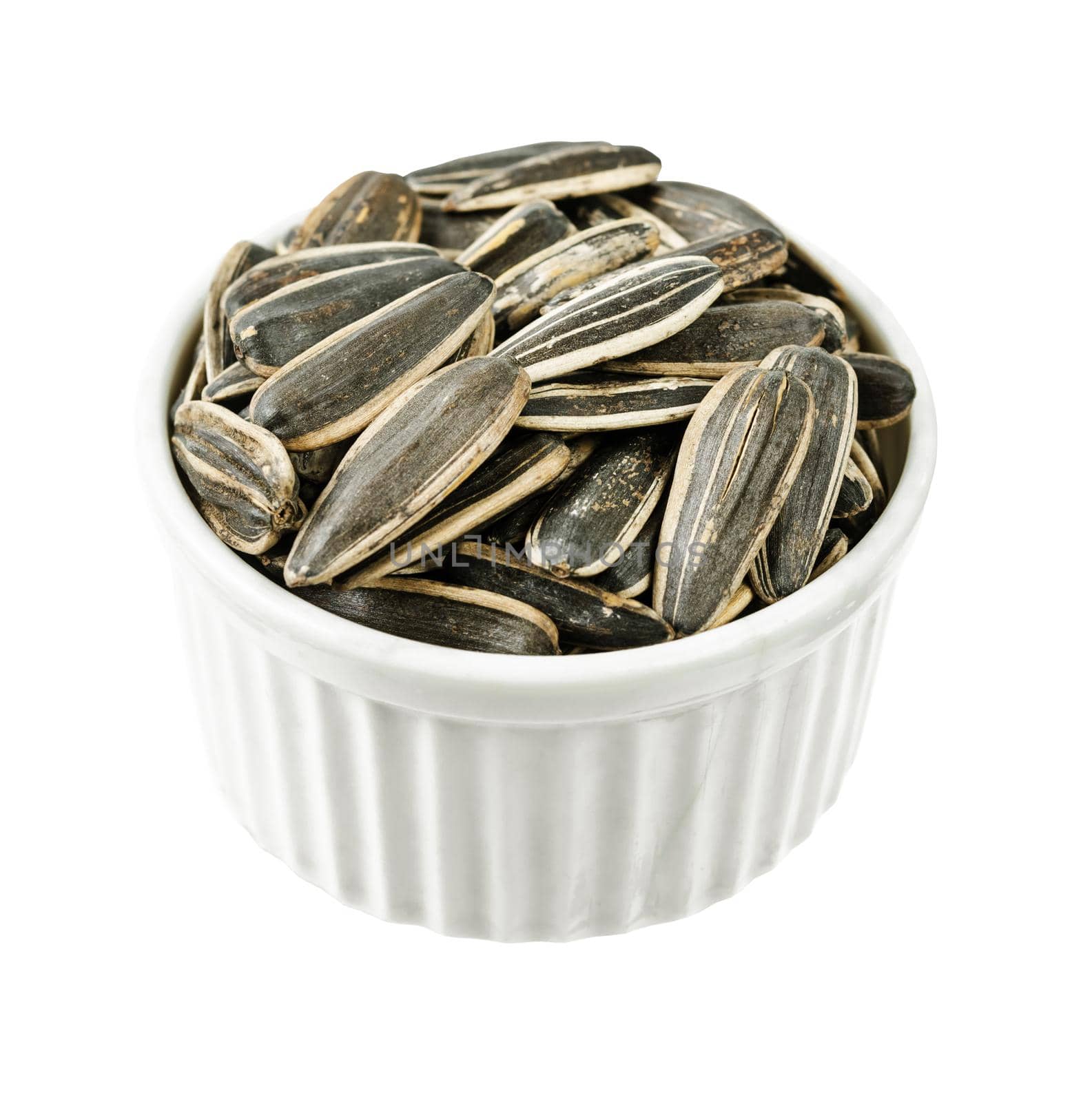 Dried Seed of Sunflower in white cup isolated on white background, Clipping path.