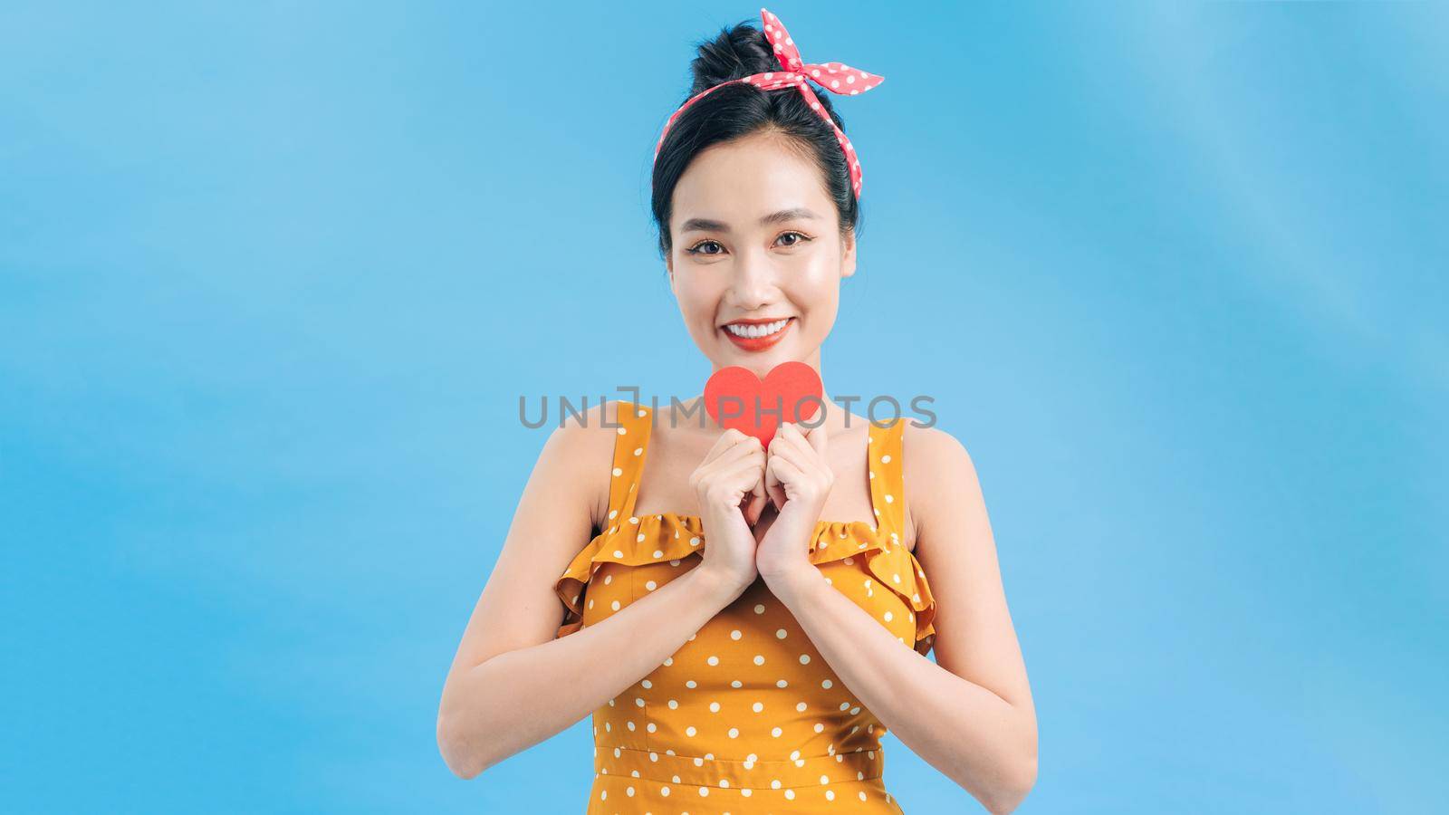 young smile woman hold red heart. valentine day concept. healthy lifestyle