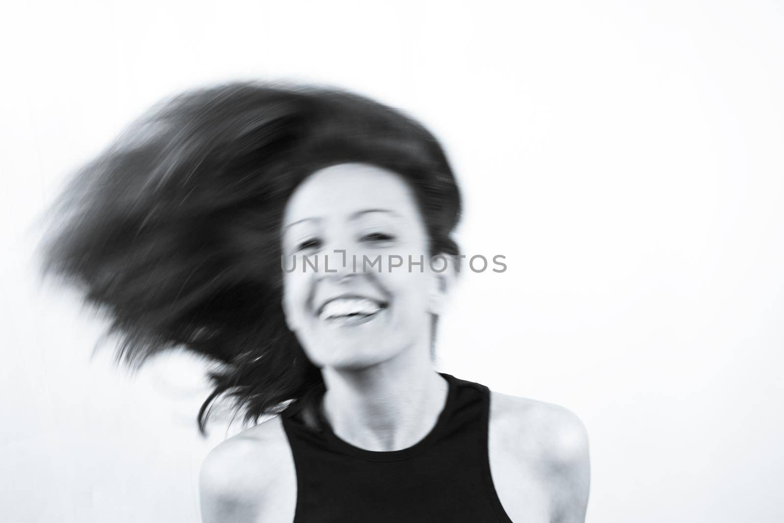 Motion blur portrait of woman over 40. Black tshirt