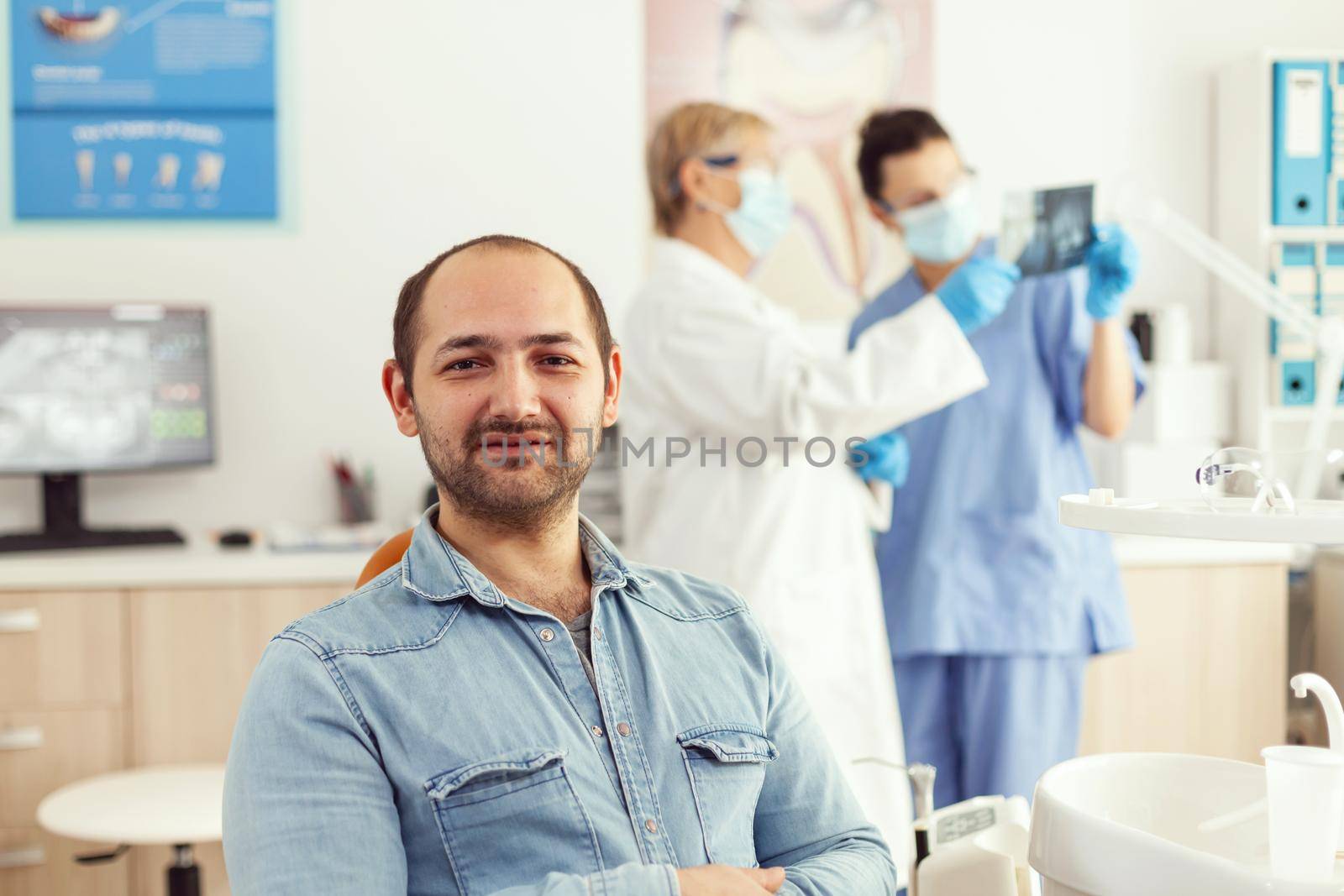 Man patient looking into camera waiting for radiography results by DCStudio