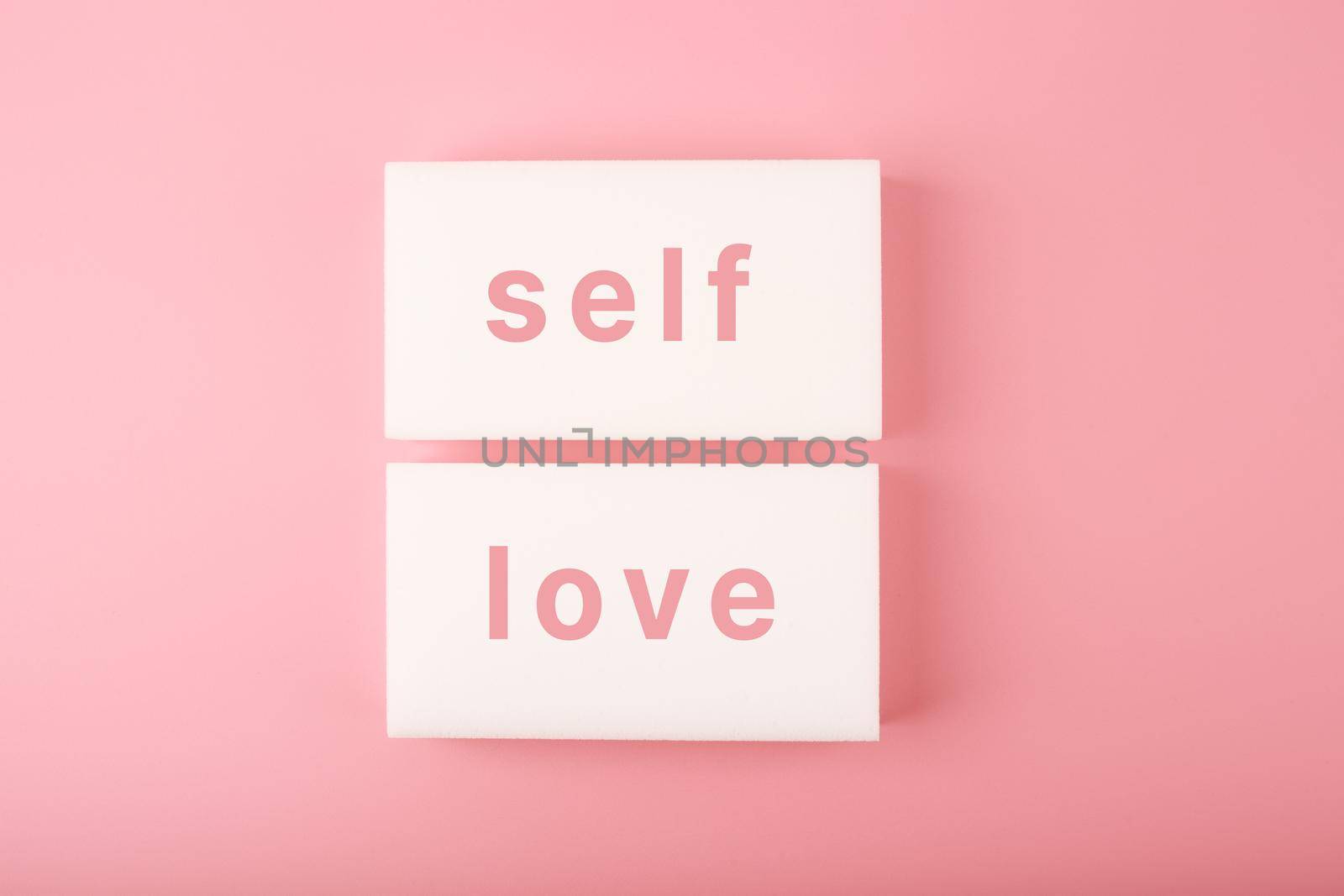 Trendy minimal self love creative concept in pink colors. Mental health, self acceptance, self care and respect or being single concept. Simple elegant composition