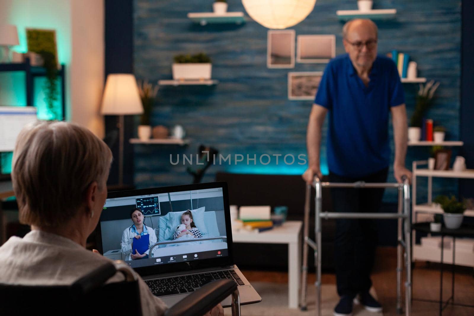 Grandmother calling doctor on video call conference by DCStudio