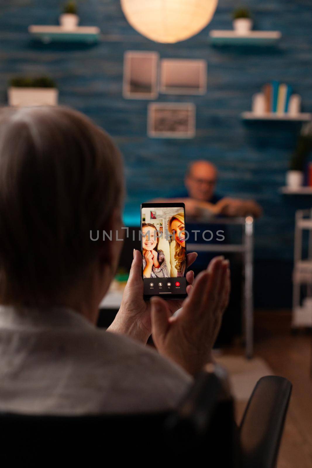 Grandmother talking to family on internet video call by DCStudio