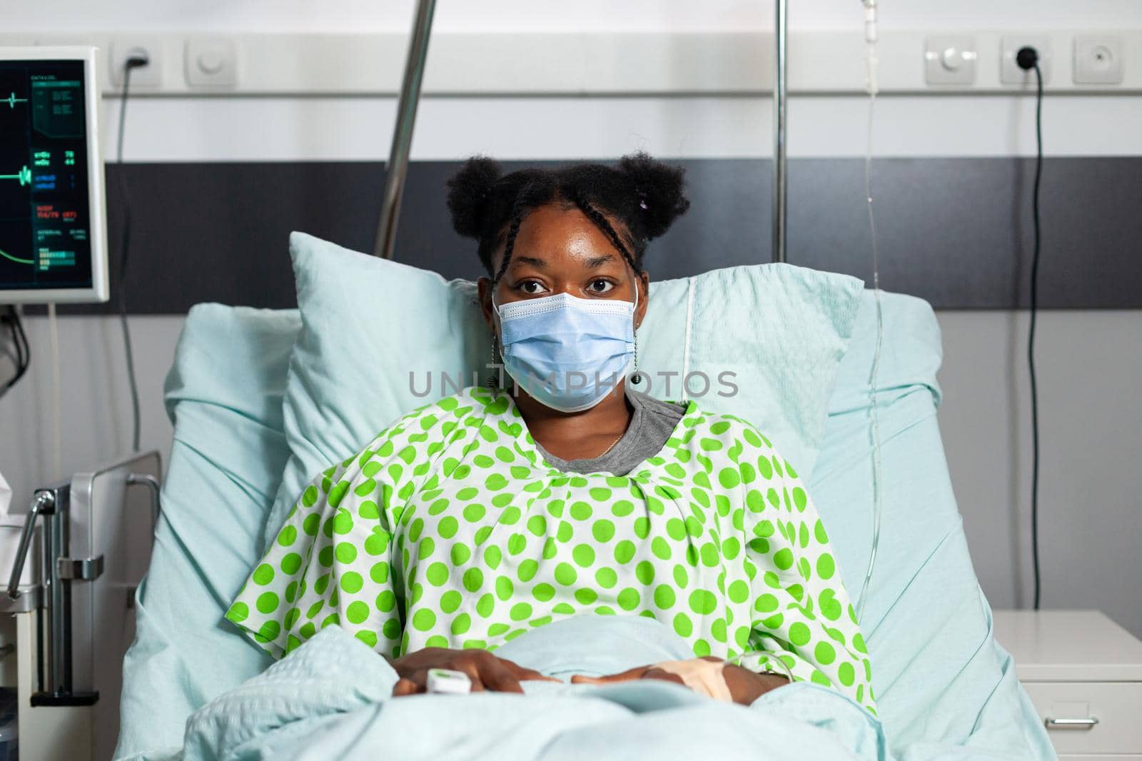 Portrait of african american patient with face mask by DCStudio