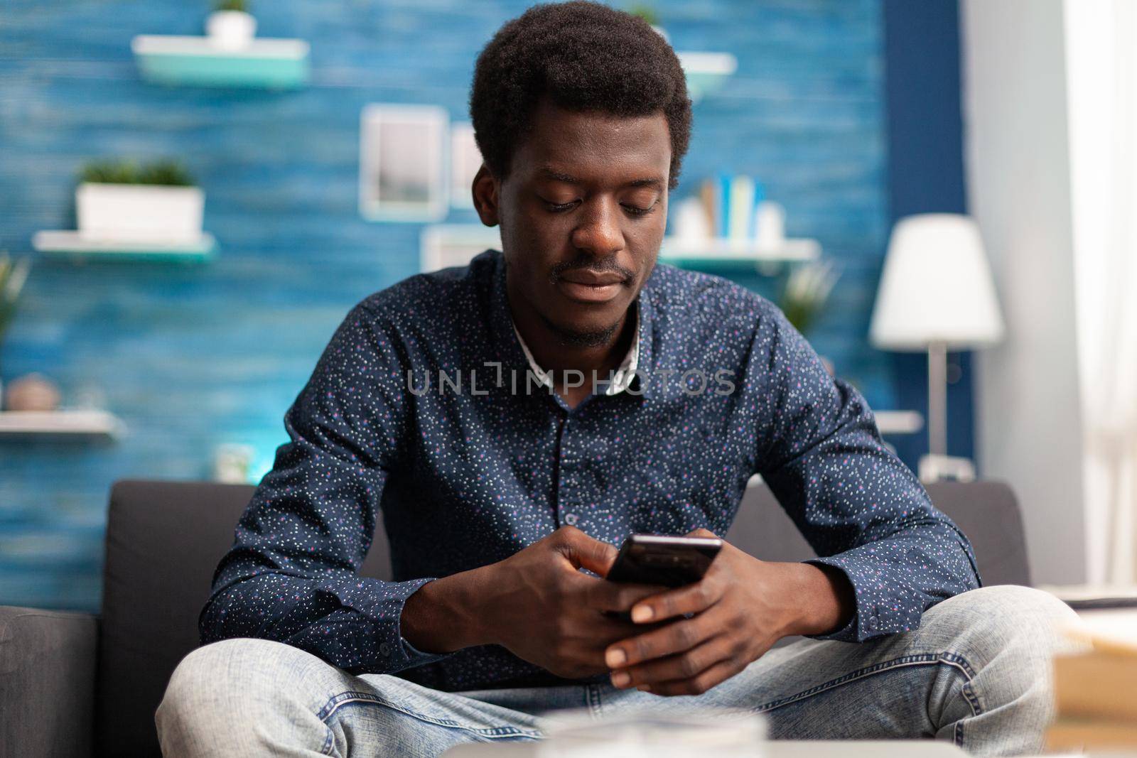 African american guy on video call using smartphone by DCStudio