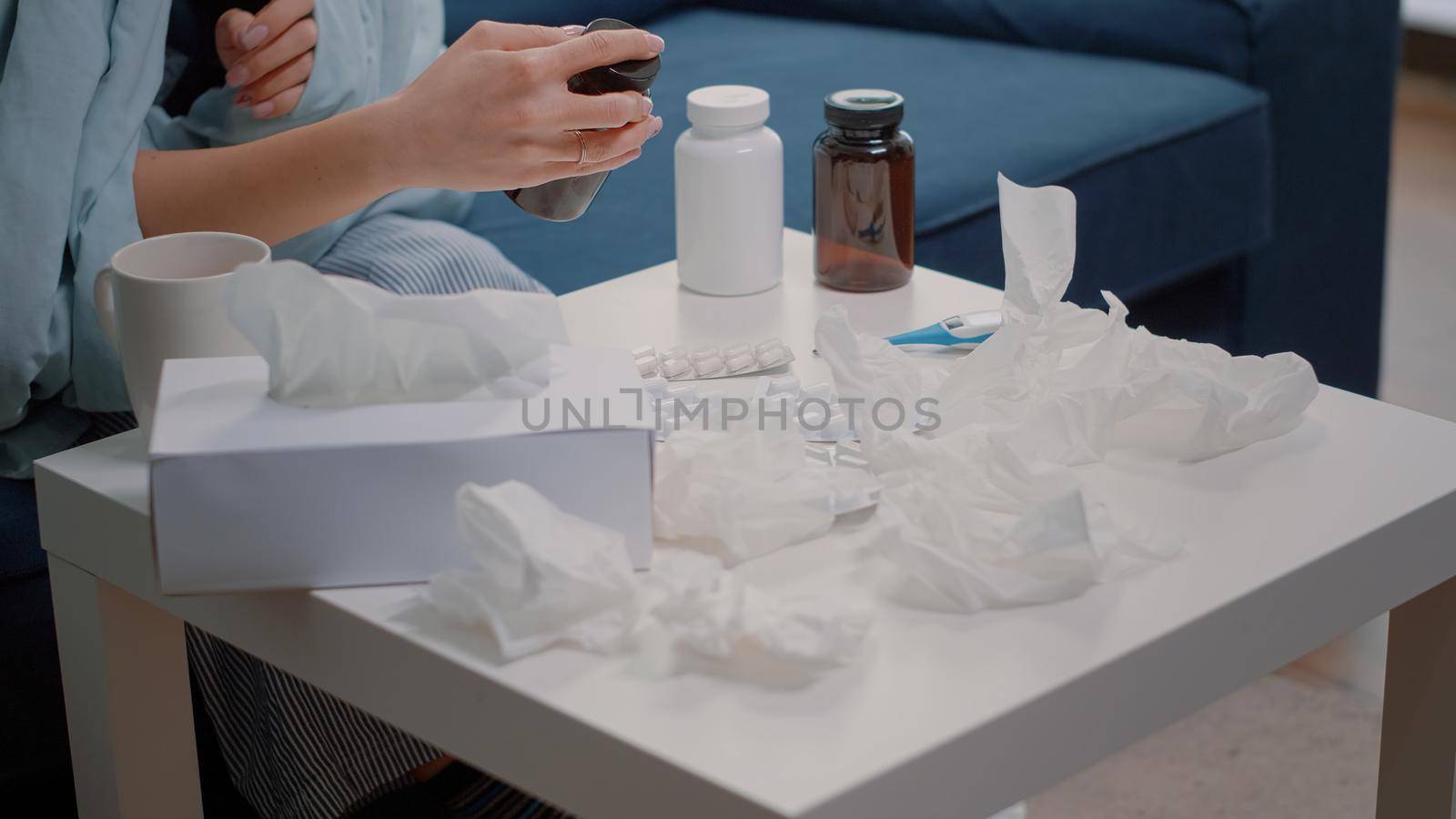 Close up of hand searching for medical treatment against flu by DCStudio