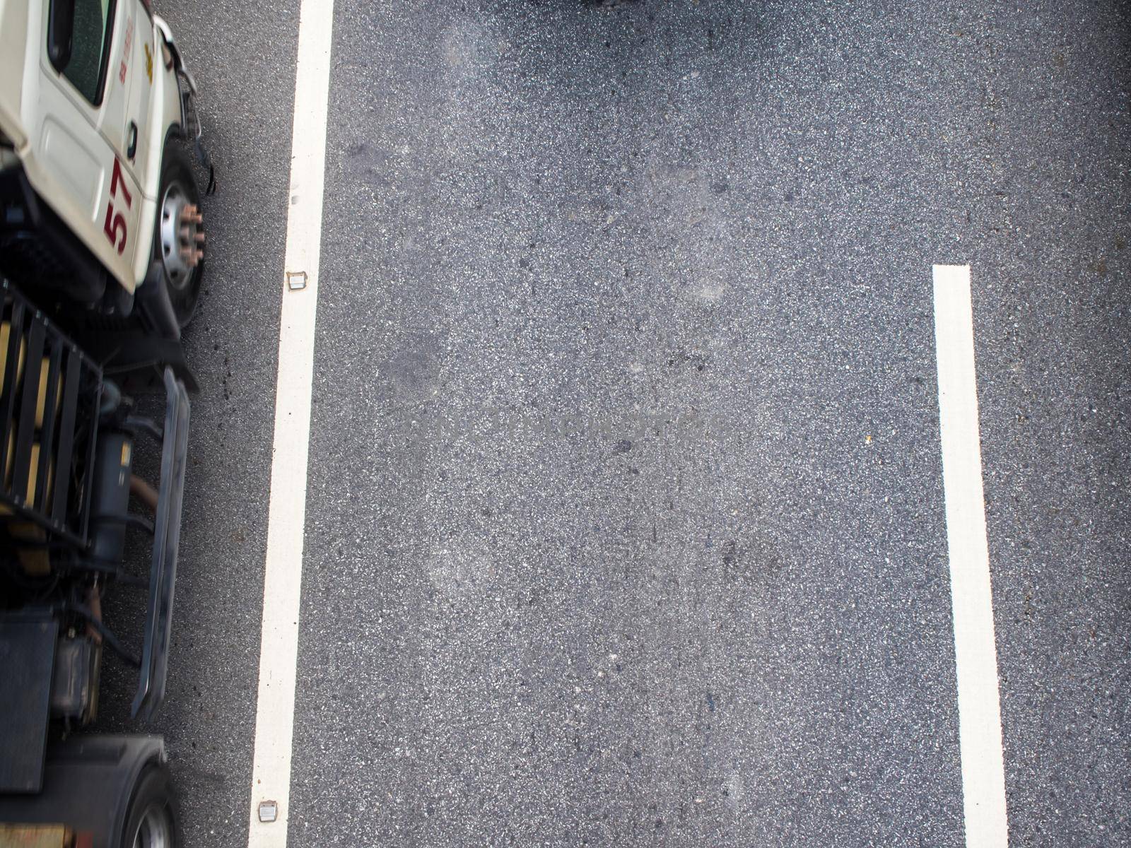 Top view of transportation truck on road by Satakorn