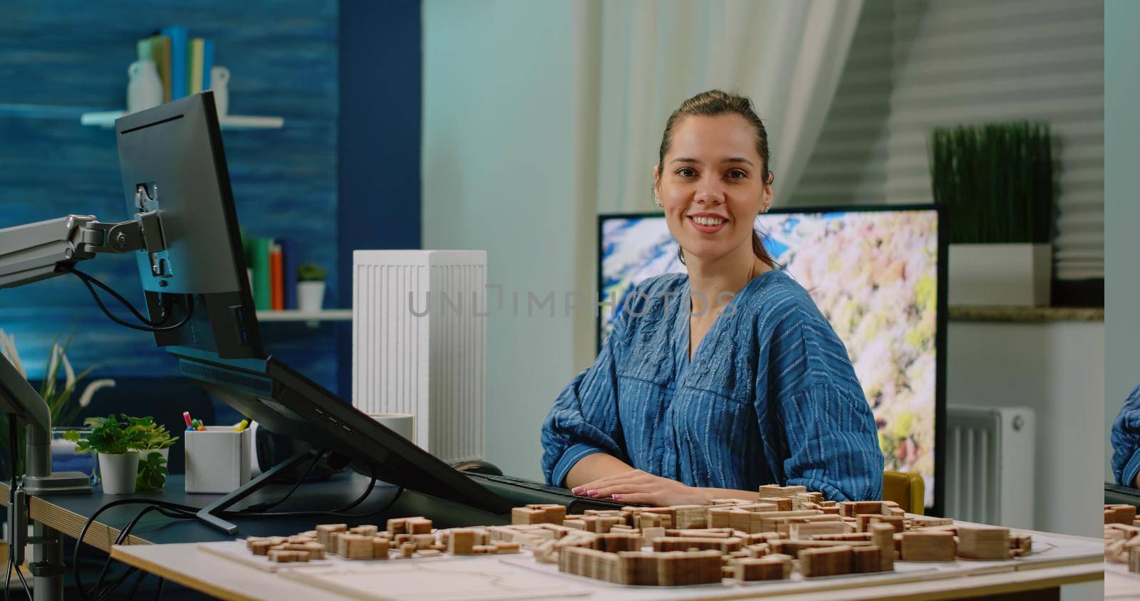 Woman working as engineer designing building model on computer with touch screen. Architect analyzing virtual maquette for construction development plan and architectural layout.