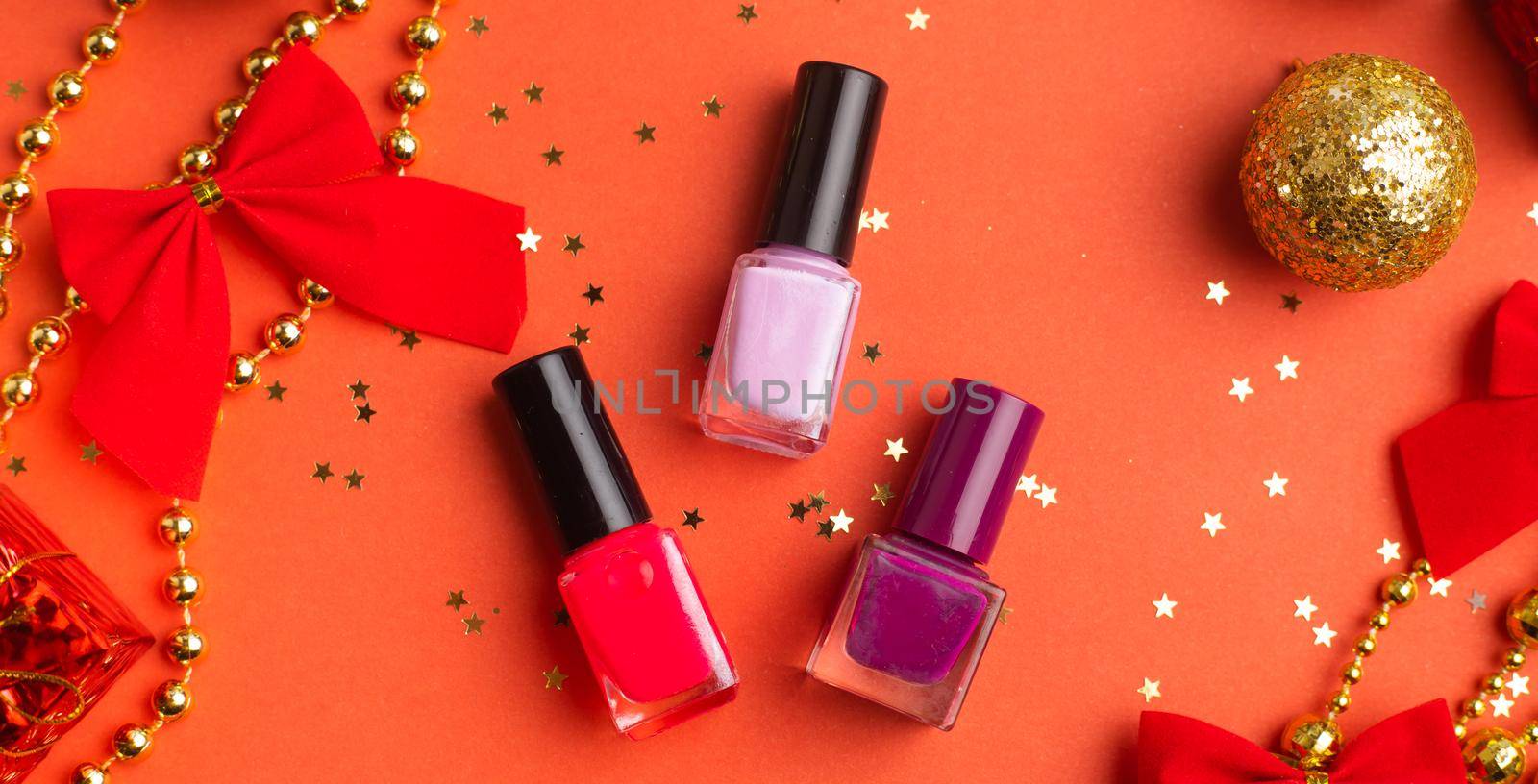 Nail polish in a New Year 's layout . New Year's gift cosmetics. The layout of the new year. A holiday gift.