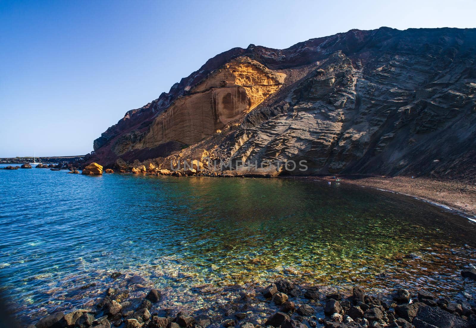 View of the Linosa volcano called Monte Nero in the beach of Cala Pozzolana di Ponente, Sicily