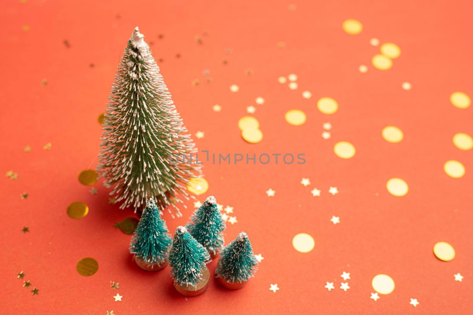 Christmas trees on a red background New Year . Christmas tree. An article about the new year of copy space. Red background.