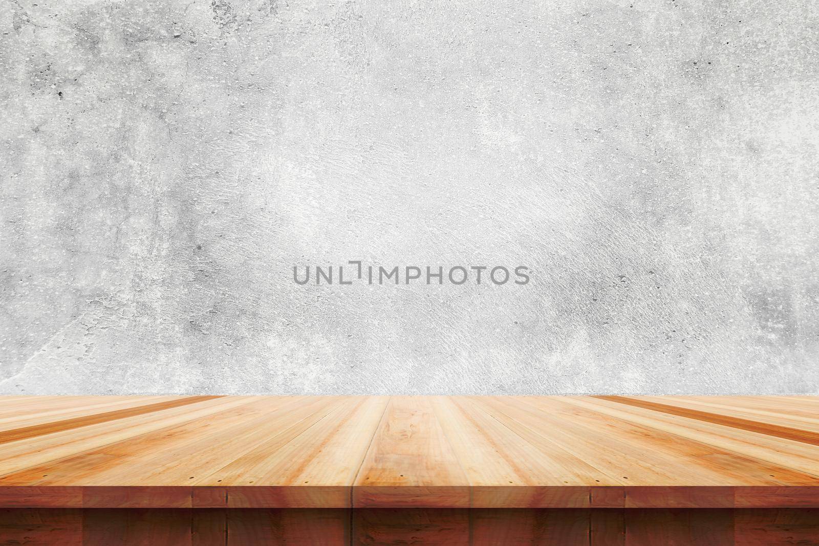 Wood table top on bare concrete wall background - can be used for display or montage your products.