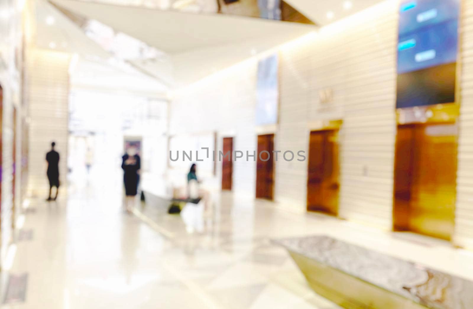 Blur light background at shop in mall for business background, blurry abstract bokeh at interior hallway by Benzoix