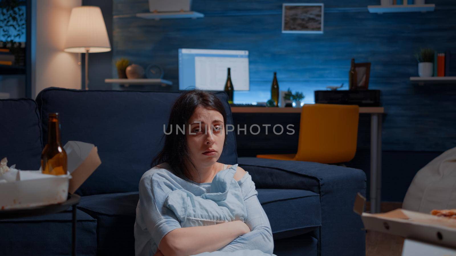 POV of unhappy depressed woman crying holding pillow sitting on floor suffering from depression psychological problem bipolar disorder loneliness, frustration anxiety. Stressed unhealthy lonely person