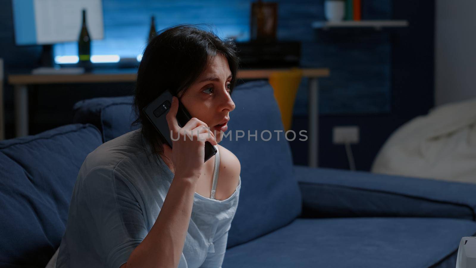 Shocked alone woman listening phone call, receving tragic news dropping smartphone feeling emotionally unstable, scared, lonely desperate, vulnerable. Traumatised person suffering from chronic disease