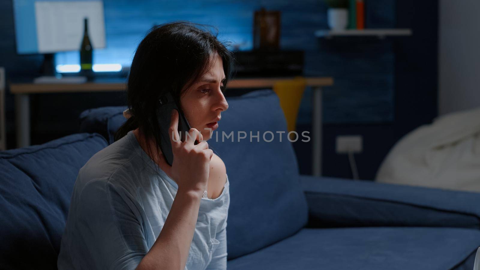 Depressed, scared, shocked, lonely woman dropping phone after hearing horible news, feeling emotionally unstable, traumatised. Person with anxiety suffering major depression because family lost
