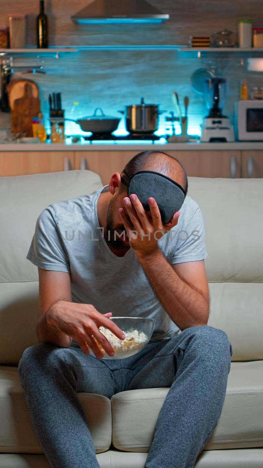Upset and unhappy man because his favourite sport team looses the championship, watching television sport. Defeat loosing caucasian male expressing anger and frustration, big sport fan
