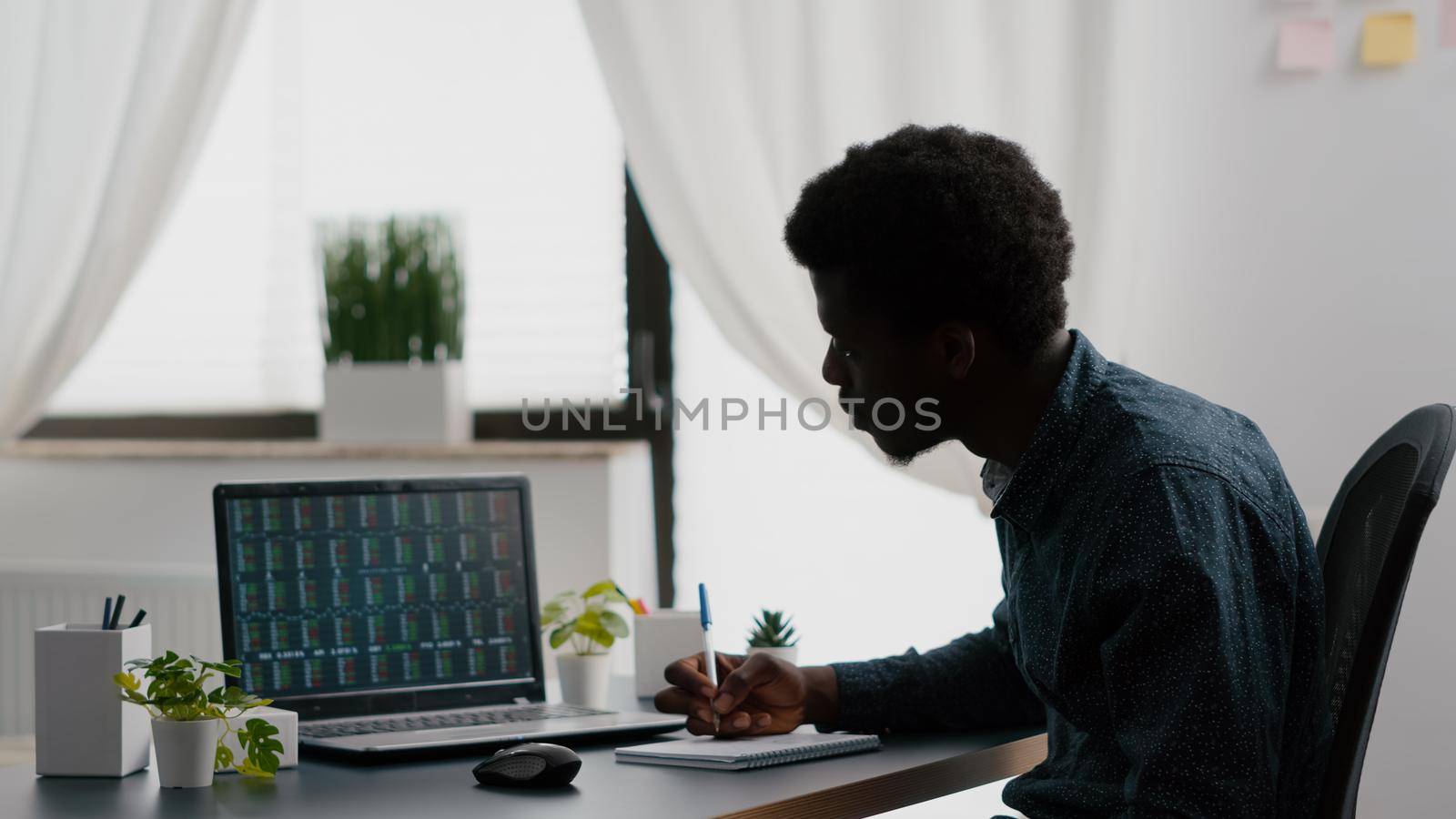 African american man analysing crypto currency stock markets trading checking stock ticker index, deciding to buy or sell digital coin money. Watching bitcoin charts forex investment finance exchange