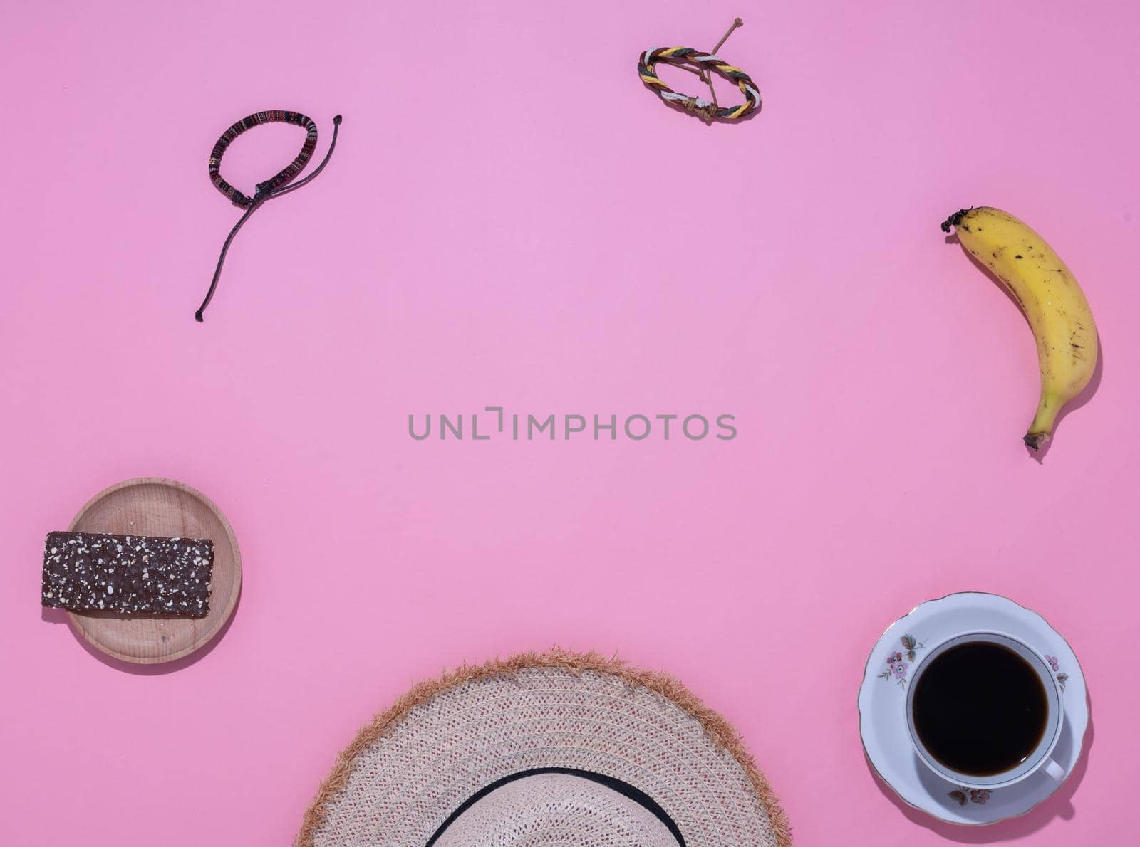 close-up of travelers' personal belongings pink background by ISRAFOTO