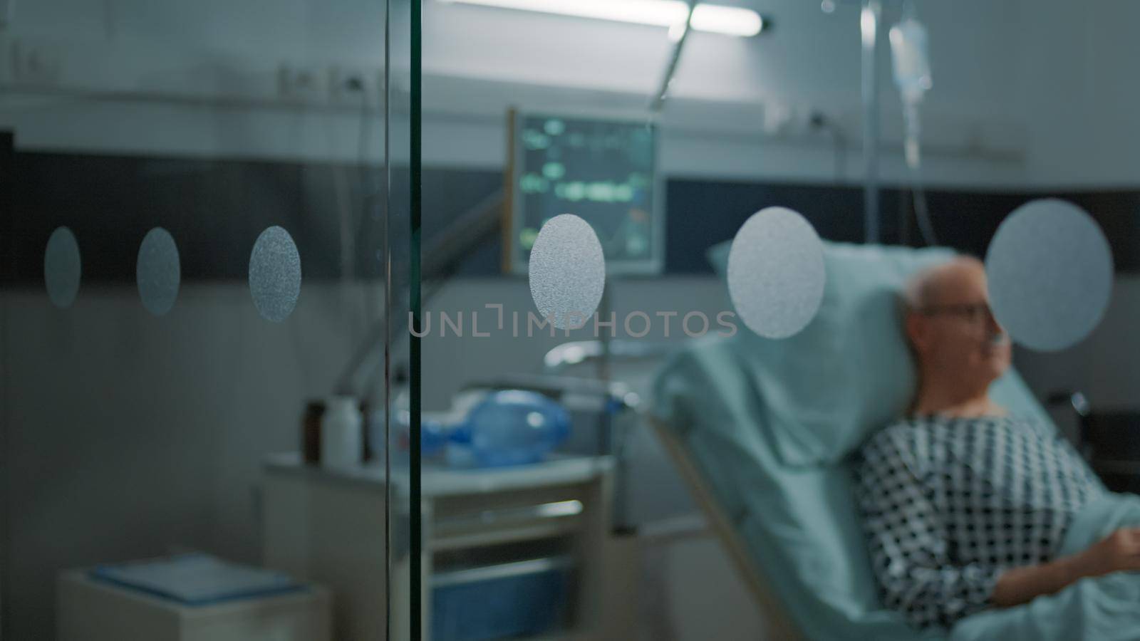 Elderly patient with disease sitting in hospital ward by DCStudio