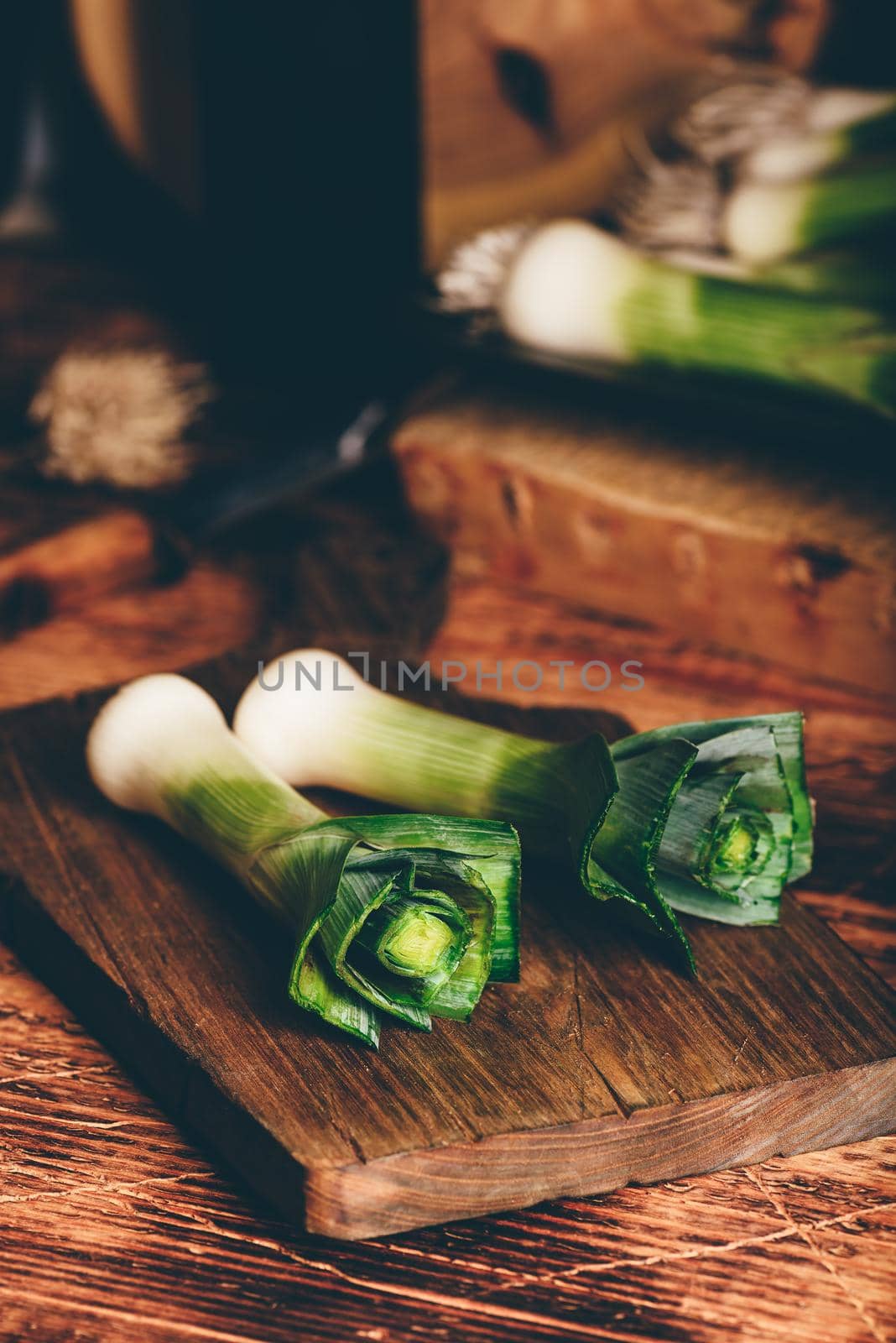 Fresh green leek on cutting board by Seva_blsv