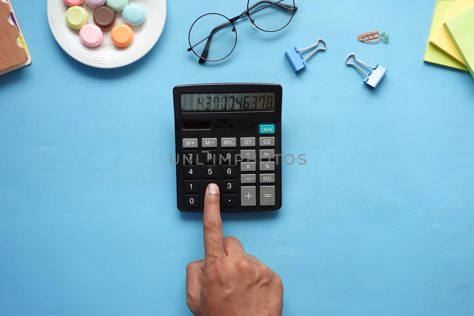 flat composition of smart phone, mask, thermometer and sanitizer on table .