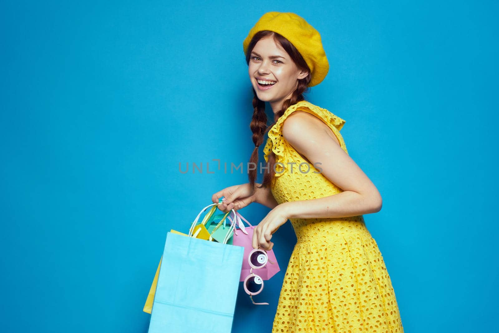 pretty woman wearing sunglasses posing shopping fashion isolated background by Vichizh