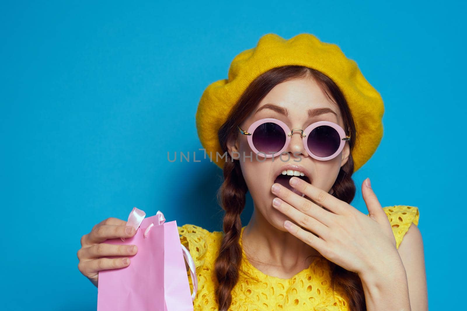 cheerful woman wearing sunglasses posing shopping fashion isolated background by Vichizh
