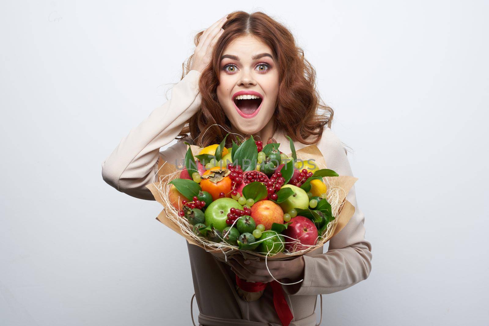 portrait of a woman fun posing fruit bouquet vitamins isolated background. High quality photo