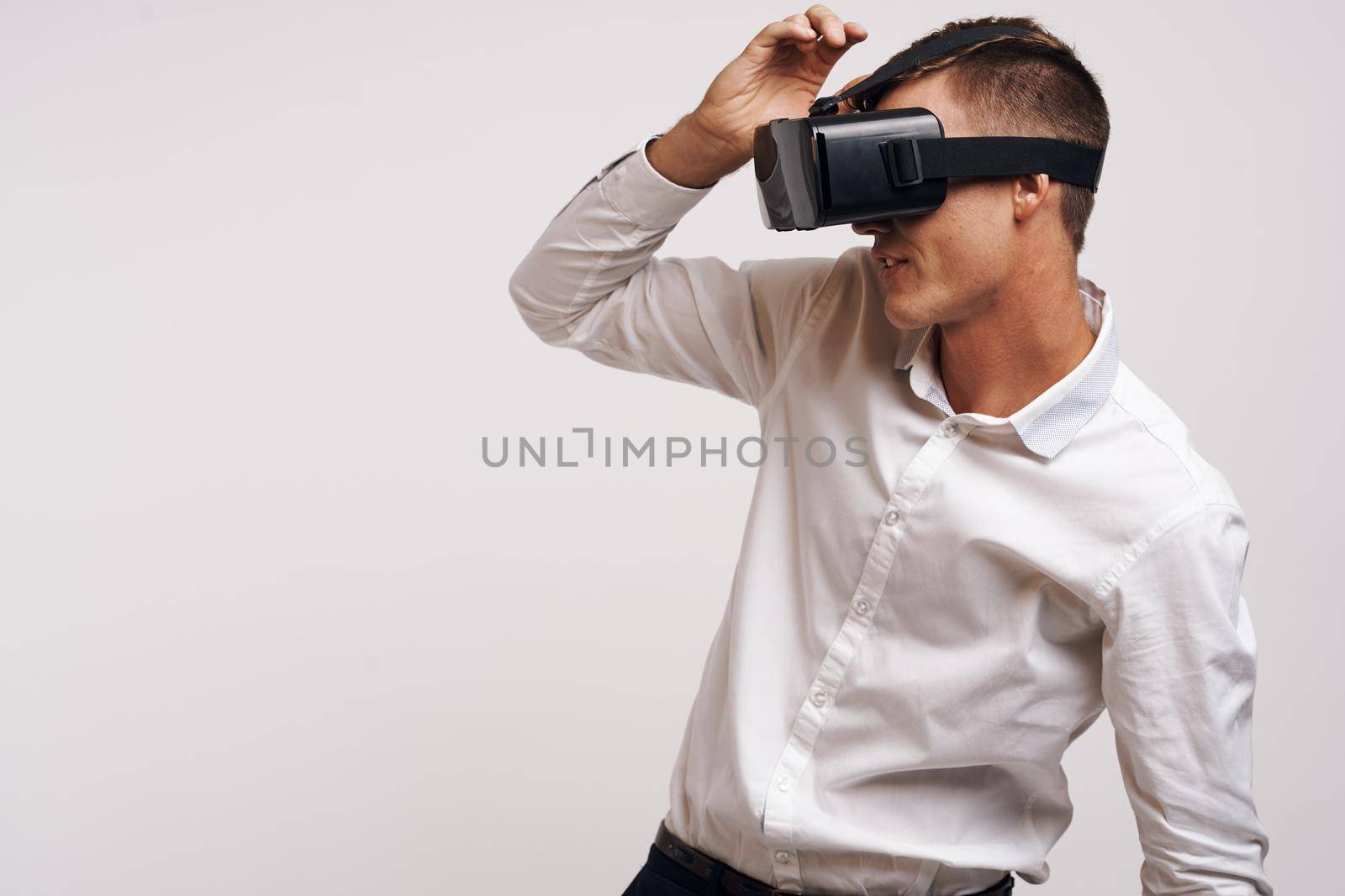 pretty man virtual reality glasses high-tech simulator technology studio by Vichizh