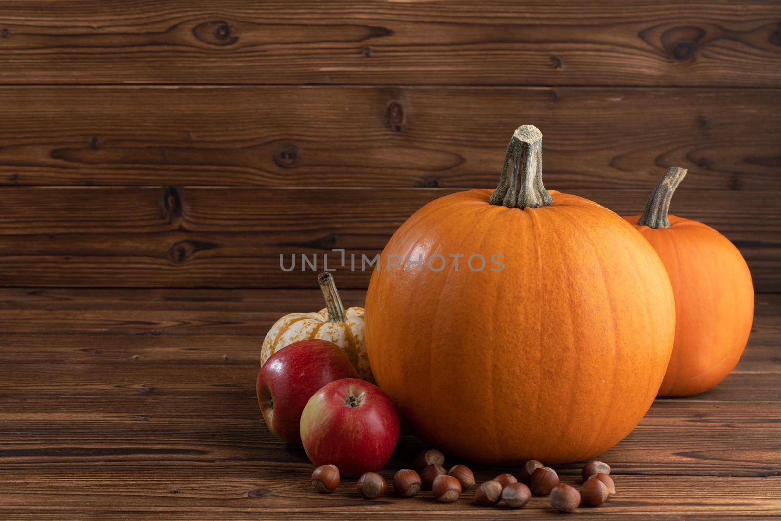 Pumpkins apples and nuts autumn stull life card thanksgiving cooking concept