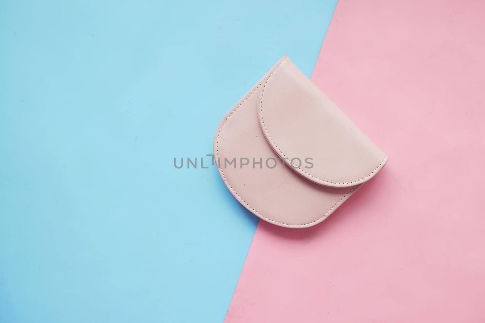 a small women purse wallet on color background .