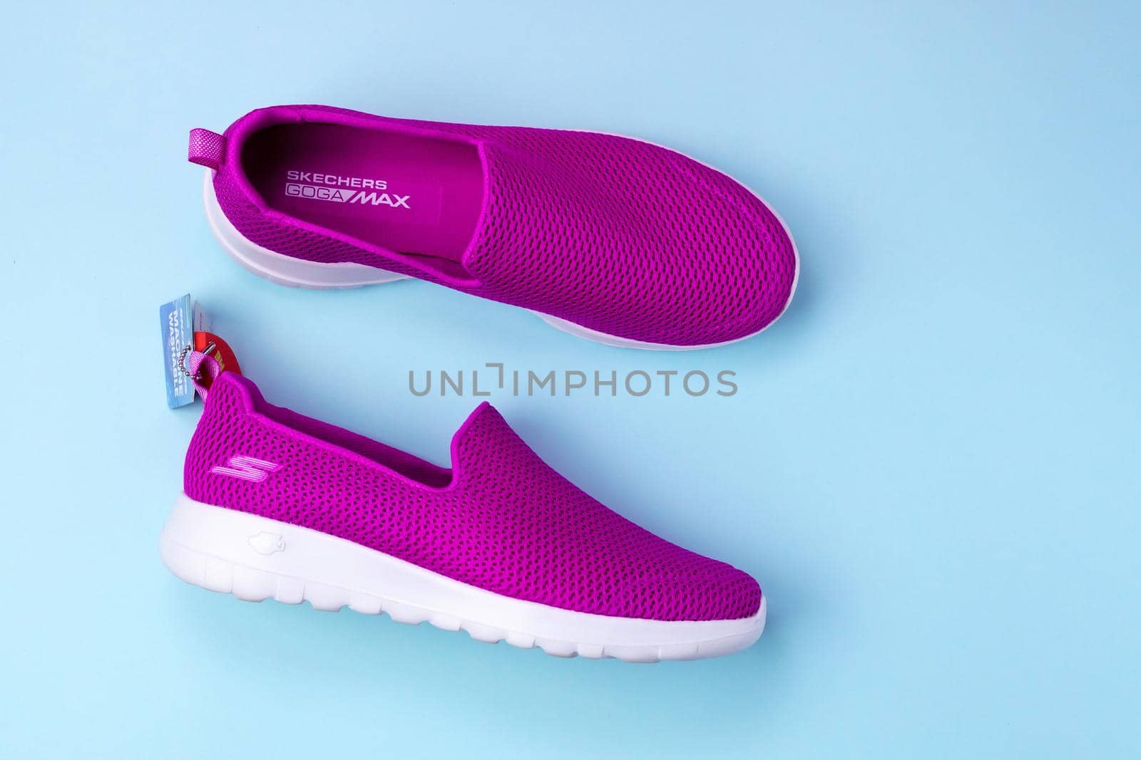 Tyumen, Russia-August 27, 2021: Slip-on shoes for women Skechers Go Walk Joy purple. Skechers USA, Inc. is an American lifestyle