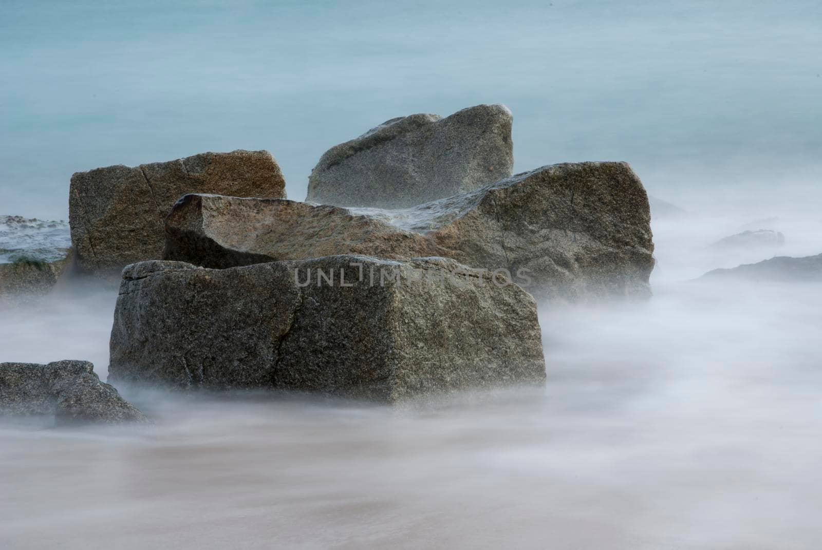 Rocks in the Seashore with a long exposure and silky water by raferto1973