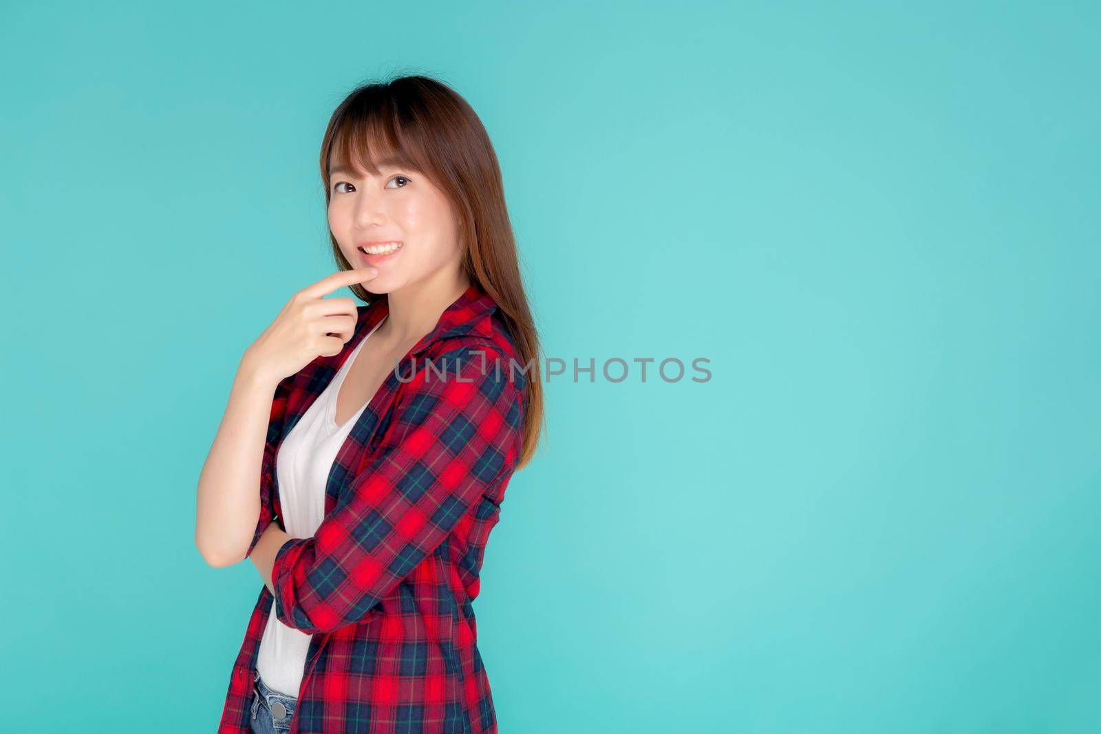 Beautiful portrait young asian woman wear clothes fashion travel thinking idea and enjoy summer holiday isolated blue background, girl smiling confident and cheerful, travel in vacation concept. by nnudoo