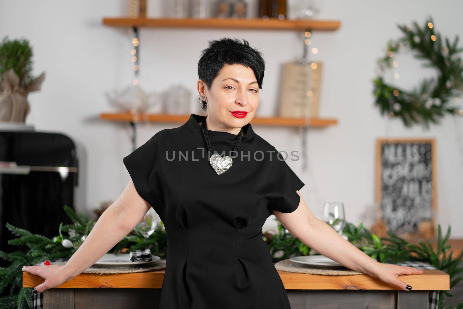 Portrait of stylish adult brunette woman celebrating New Years.