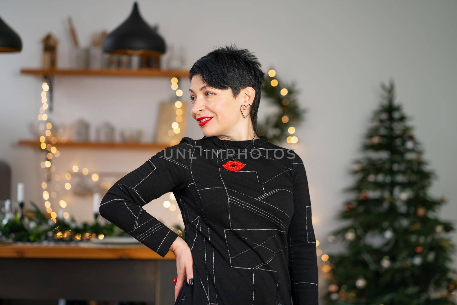 Portrait of stylish adult brunette woman celebrating New Years.