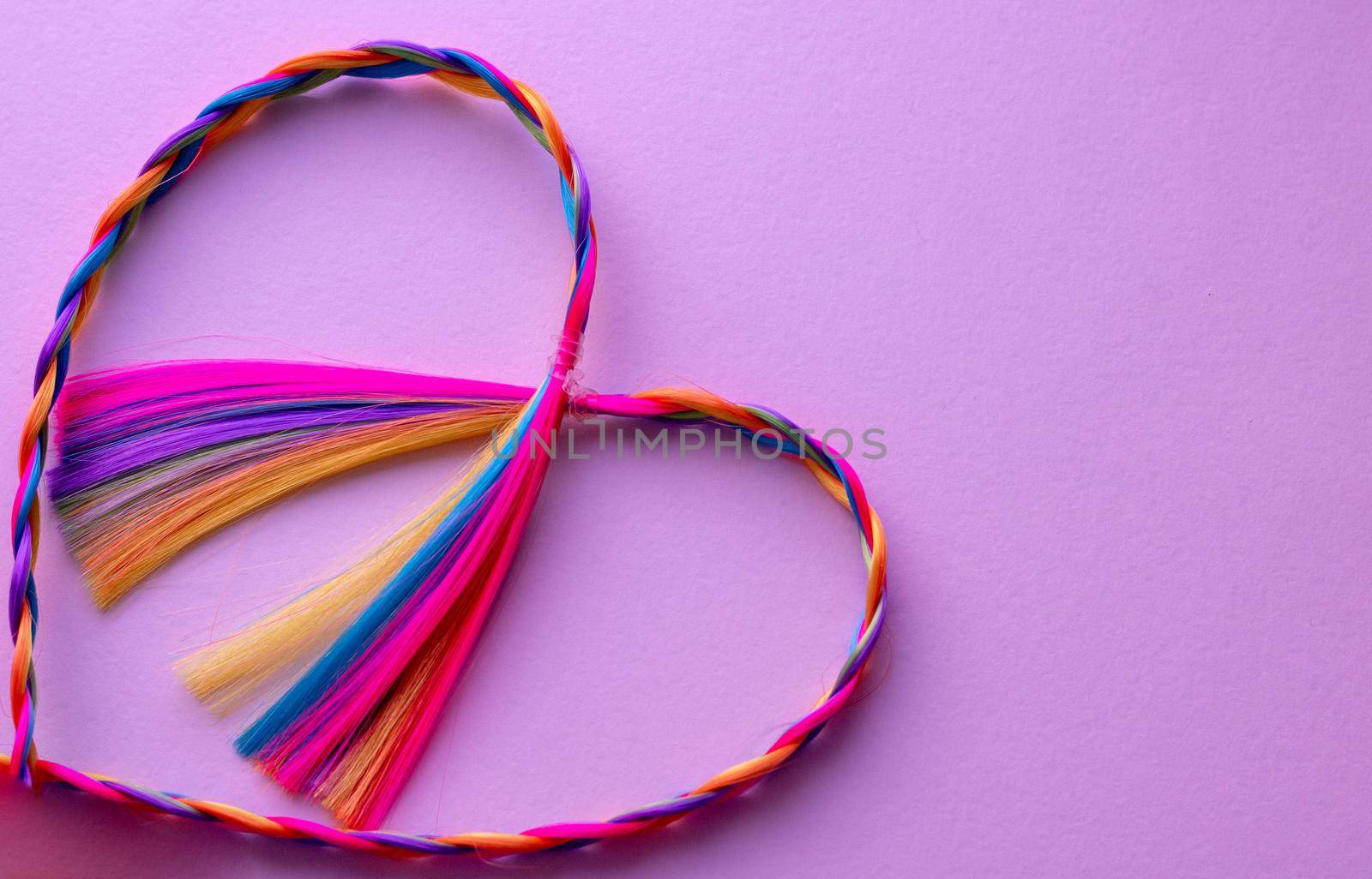 Kanekalon. Colored artificial strands of hair. Material for plaiting braids.abstract heart