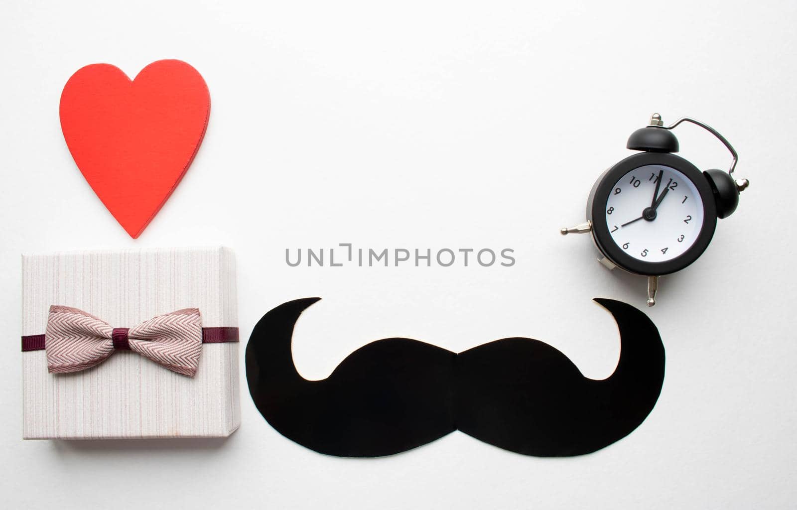 Gift box with a bow and a mustache.The concept of father's day by lapushka62