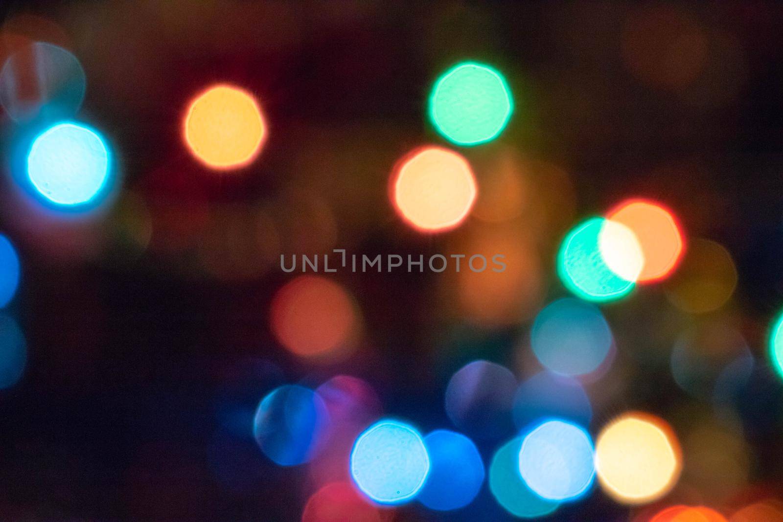 abstract Red glitter lights background. defocused. Colorful light bulbs and vivid round bokeh lights tree festive mood lightning by lapushka62