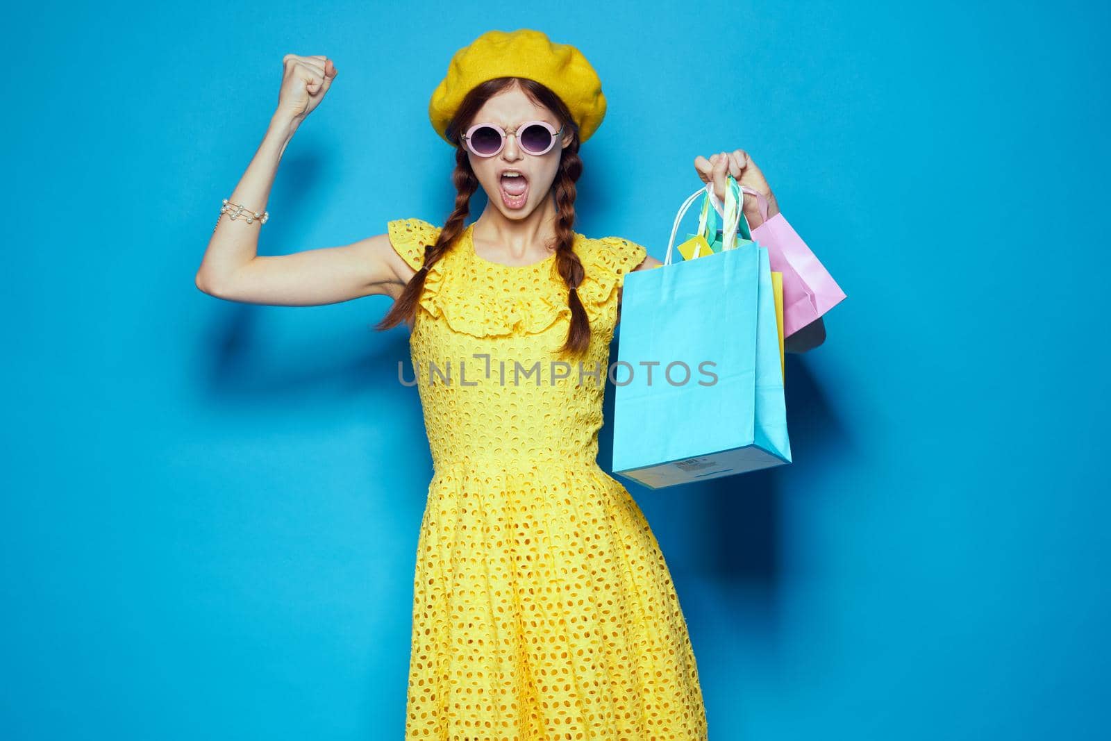 pretty woman wearing sunglasses posing shopping fashion isolated background by Vichizh